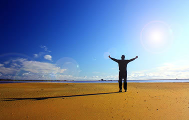 A person standing in the light of church healing.